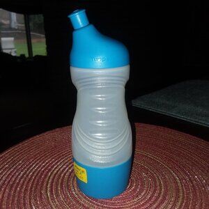 Sports Bottle. Squeezable, reusable. Removable bottom for keys, money, ID, etc.